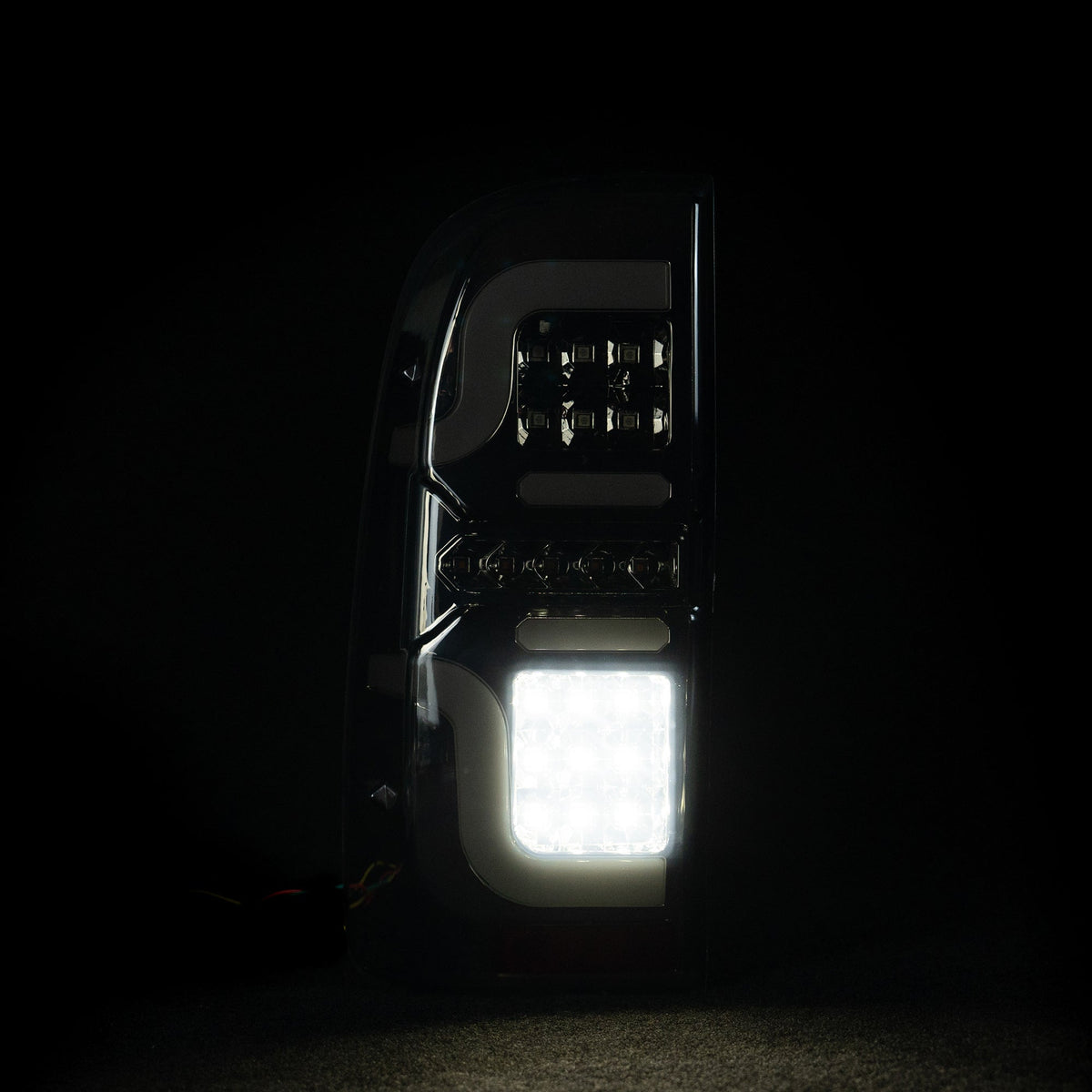 Blacked Out 'Swirl' LED Tail Lights for N70 Hilux
